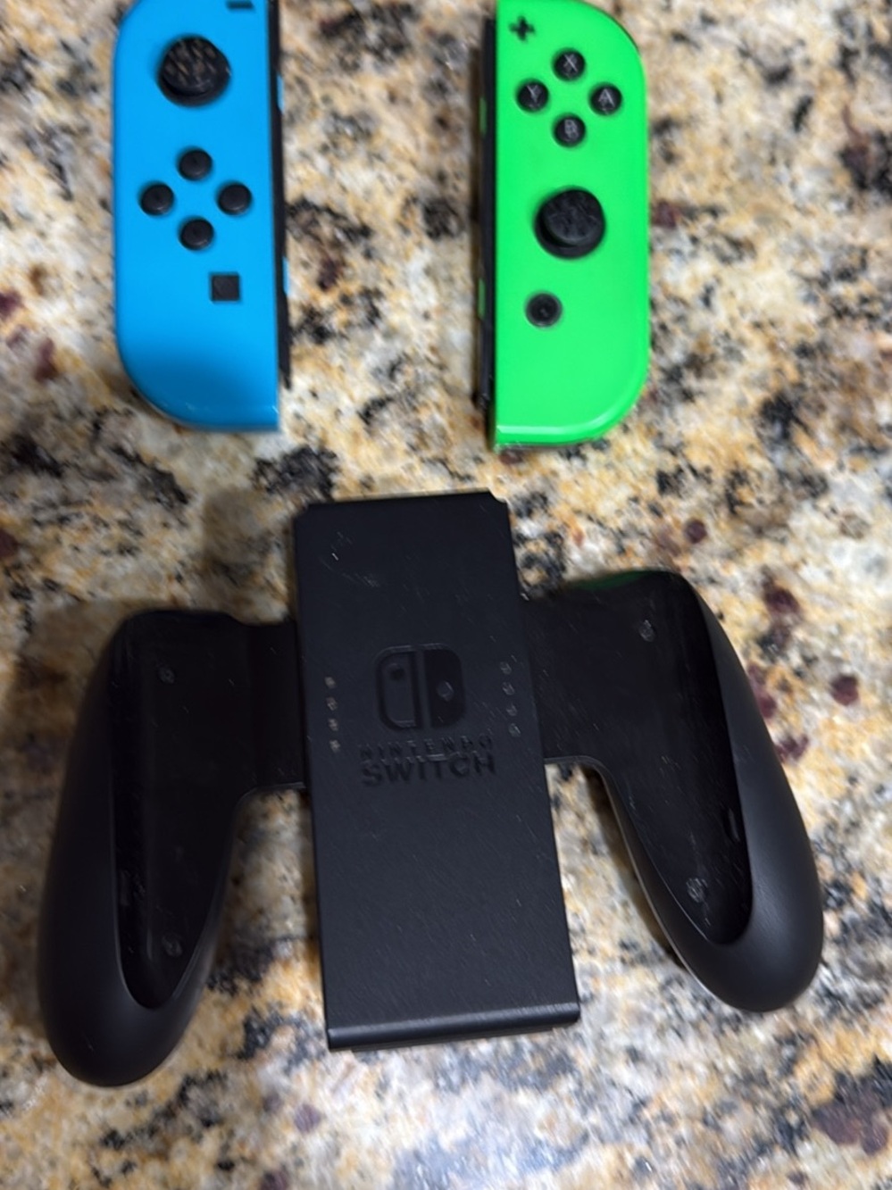 Nintendo Black Joy-Con Controller Grip with Neon Blue and Neon Green Joy-Con